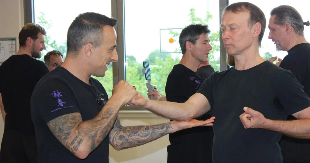 Sifu Nima instructing a group and Video can be seen being recorded in the background